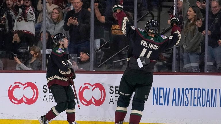 Arizona Coyotes' Clayton Keller (9) and Juuso Valimaki (4) celebrate...