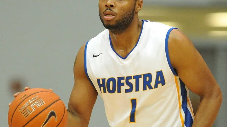 Hofstra's Juan'ya Green dribbles upcourt during the first half of...