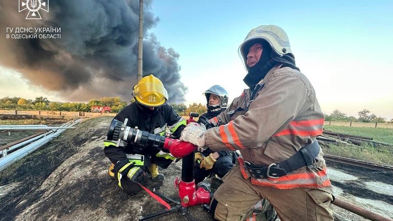 In this photo provided by the Ukrainian Emergency Service, rescuers...