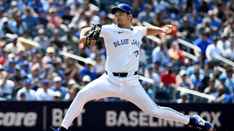 Toronto Blue Jays starting pitcher Yusei Kikuchi (16) throws to...