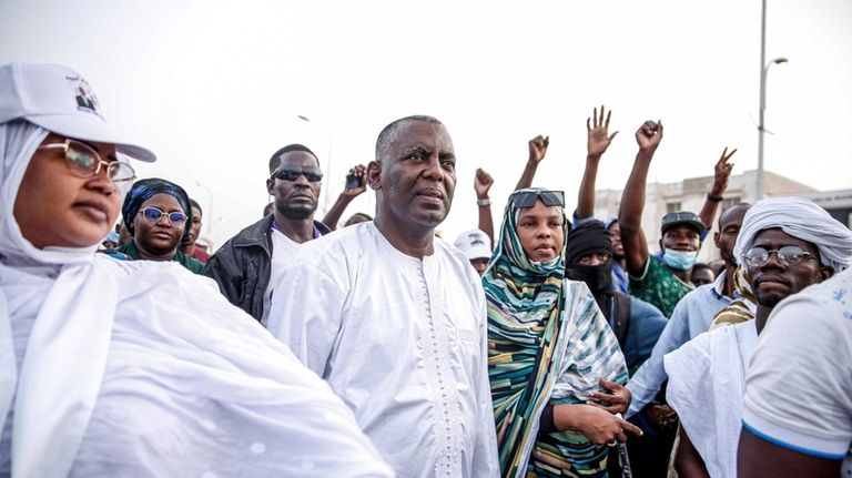 Presidential candidate Biram Ould Dah Ould Abeid, center, takes part...