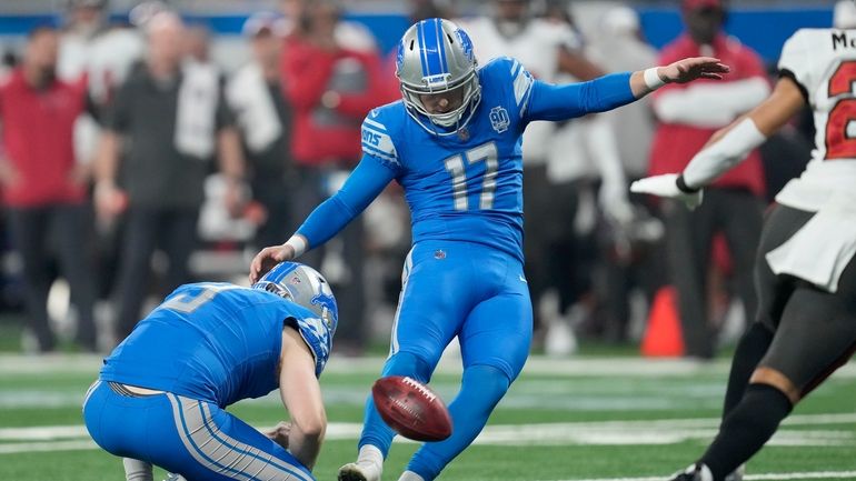 Detroit Lions place kicker Michael Badgley (17), with Jack Fox...