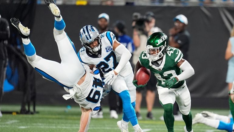 New York Jets' Brandon Codrington (43) returns a punt against...