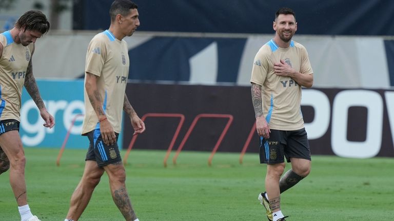 Lionel Messi, right, practices with the Argentina team, Thursday, July...