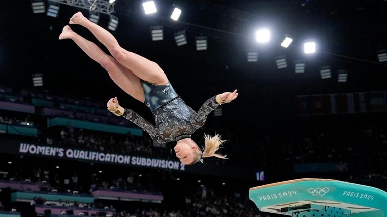 Jade Carey, of United States, competes on the vault during...