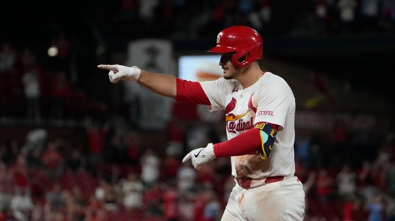 St. Louis Cardinals' Nolan Arenado celebrates after hitting a walk-off...