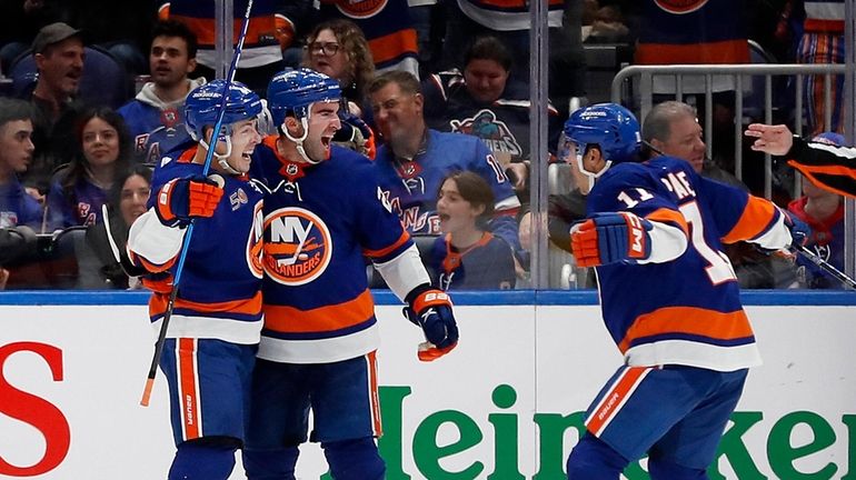 Kyle Palmieri #21 of the Islanders celebrates his second period goal...