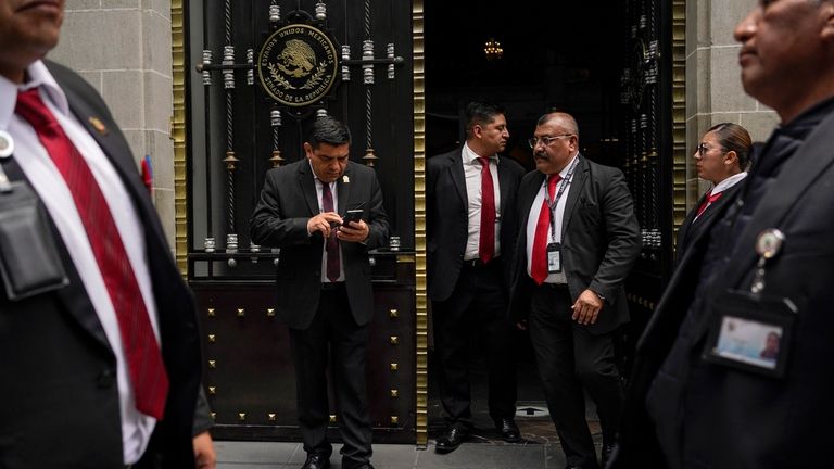 Security guards control access to an alternate headquarters for senators...