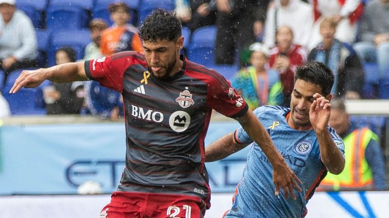 New York City FC Andres Jasson, right, duels for the...