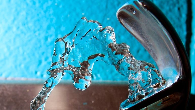 Water flows from a water fountain in Concord, N.H., on...