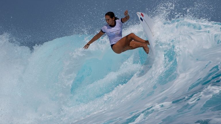 Vahine Fierro, of France, surfs on a training day ahead...