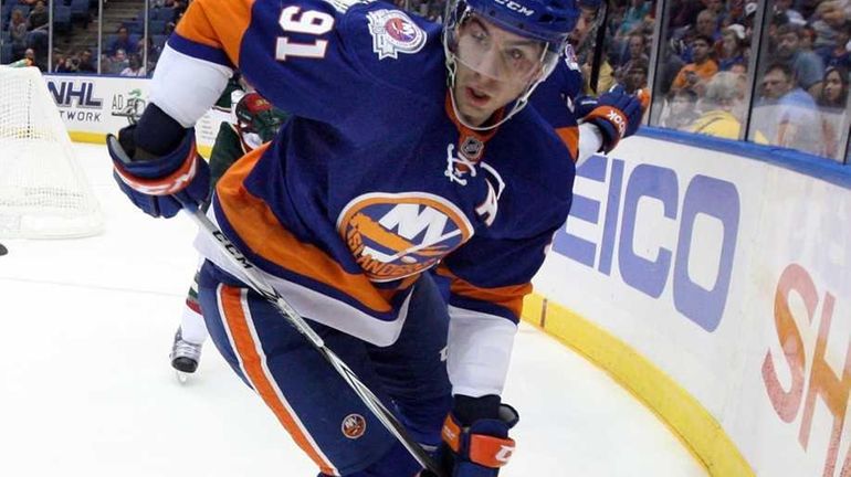 John Tavares #91 of the New York Islanders skates against...