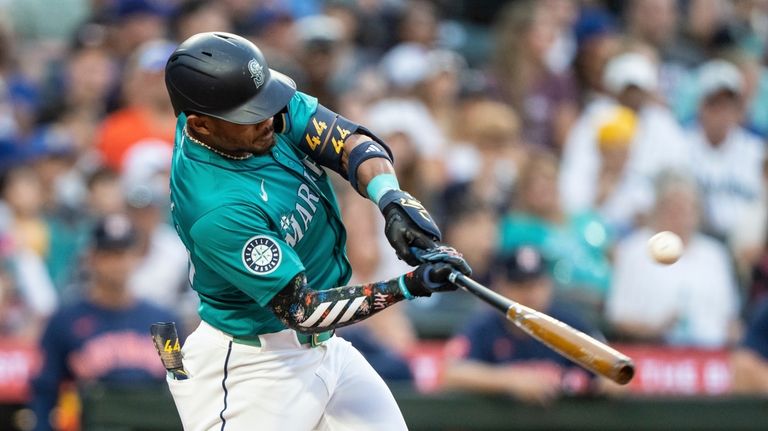 Seattle Mariners' Julio Rodriguez hits a two-run home run during...