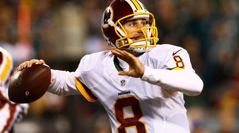 Quarterback Kirk Cousins #8 of the Washington Redskins looks to...