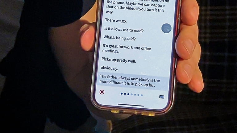 Anastasi uses an app on his phone to communicate.