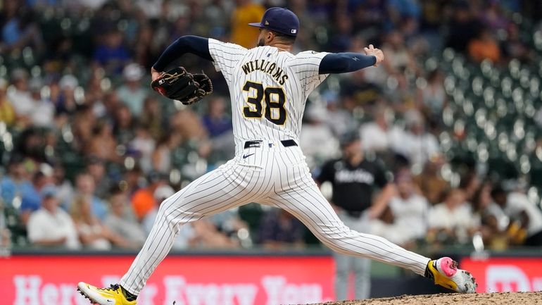 Milwaukee Brewers' Devin Williams pitches during the ninth inning of...