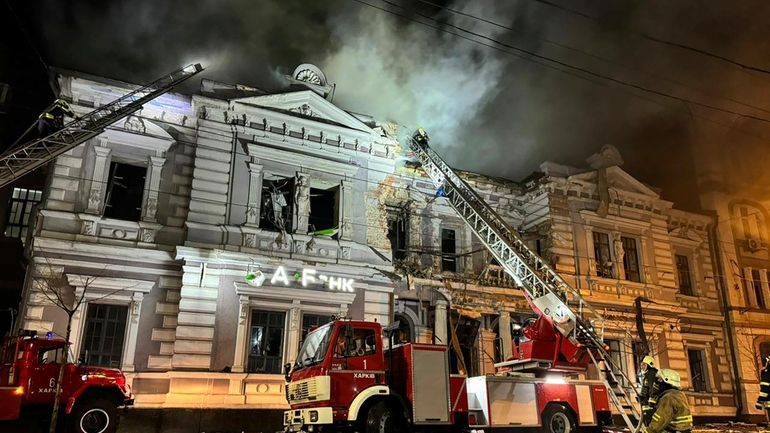 In this photo provided by the Ukrainian Emergency Service, firefighters...