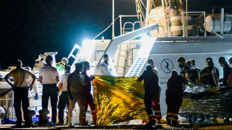 The bodies of some of the 64 migrants missing in...