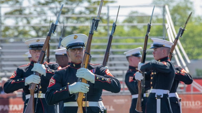 The Marine Corps drill team presentation at Walt Whitman High...