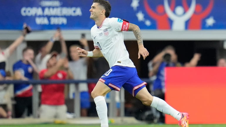 Christian Pulisic of the United States celebrates after scoring his...