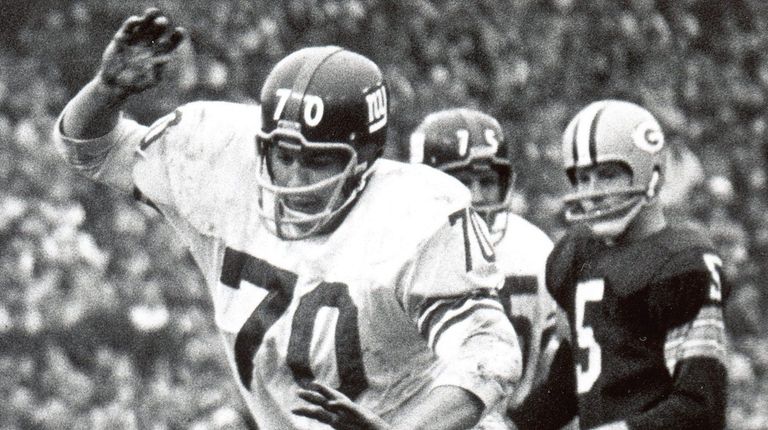 Linebacker Sam Huff #70 of the New York Giants leaps...