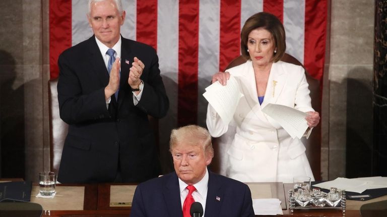 House Speaker Nancy Pelosi rips up pages of the State of...