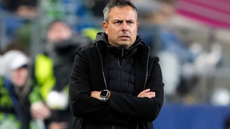 FC Dallas head coach Nico Estévez looks on from the...