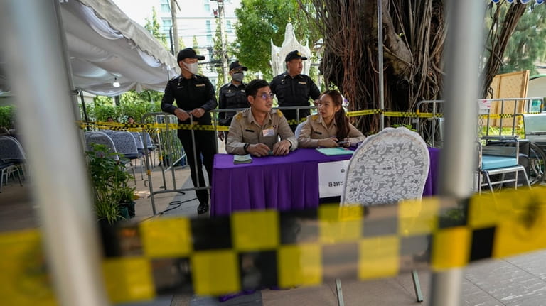 Thai officer waiting potential candidates to become members of Thailand's...