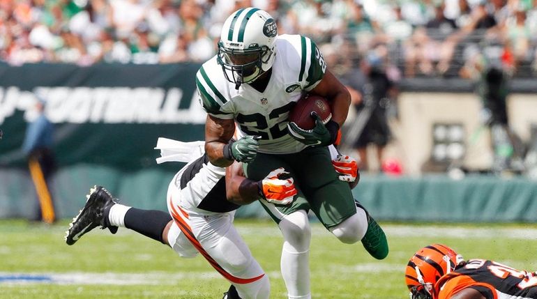 Matt Forte of the New York Jets runs the ball...