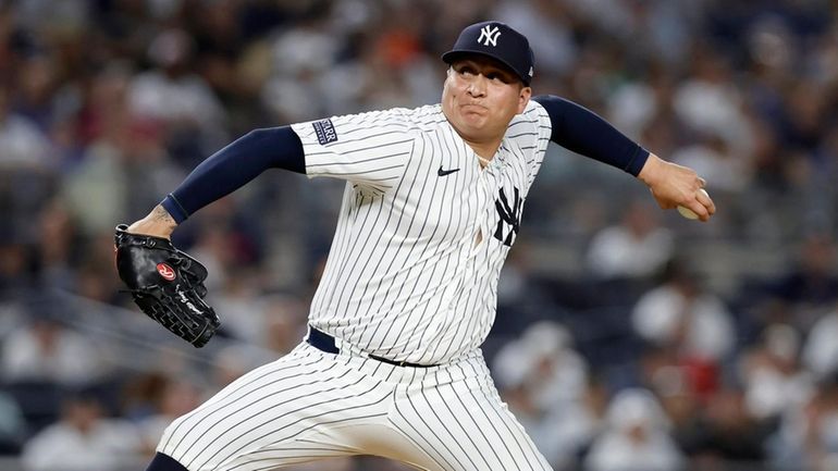 Victor Gonzalez #47 of the Yankees pitches during the sixth inning...