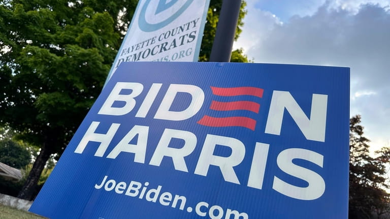 A sign for Democratic President Joe Bide. stands outside the...