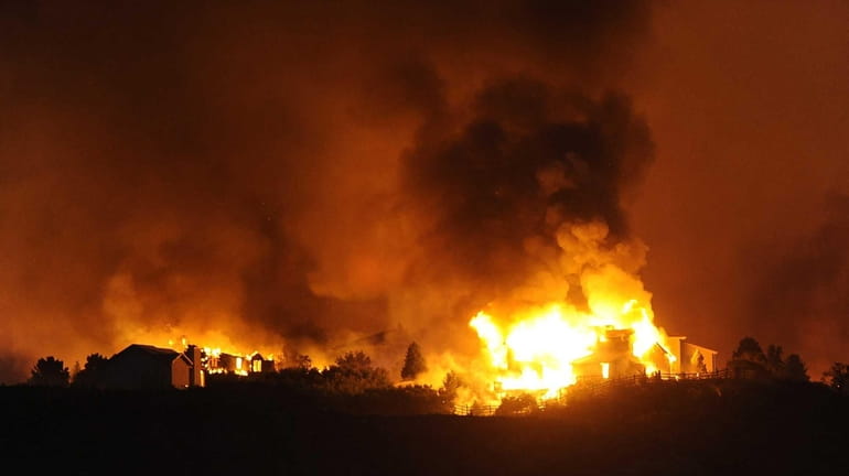 The Waldo Canyon fire destroys homes in the Mountain Shadows...