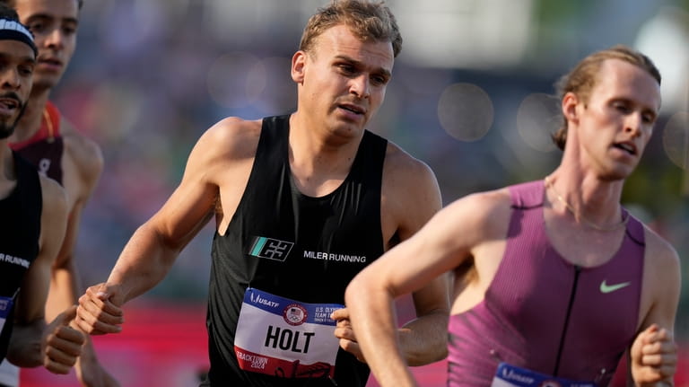 Eric Holt competes in a heat in the men's 1500-meter...