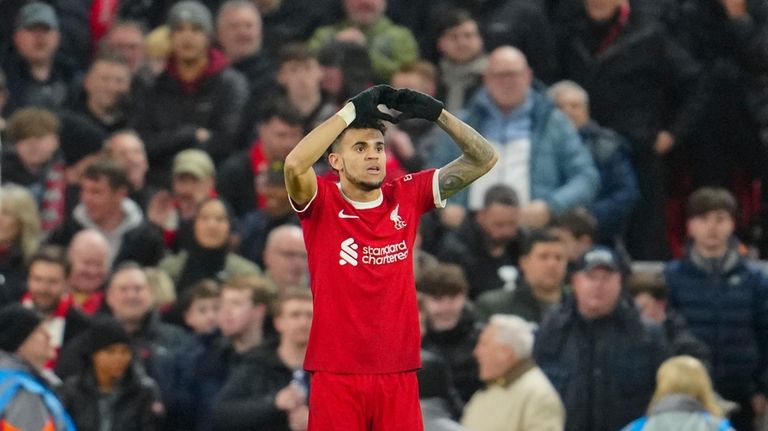 Liverpool's Luis Diaz celebrates after scoring his side's third goal...