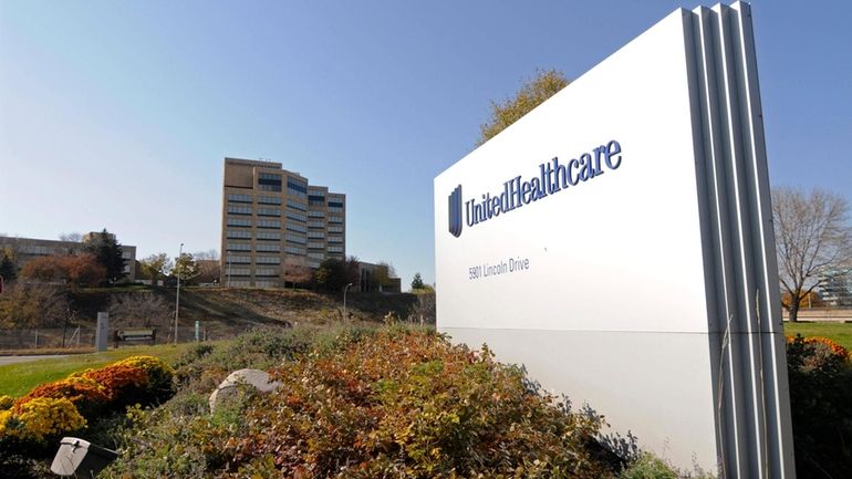 A sign stands on UnitedHealth Group Inc.'s campus in Minnetonka,...