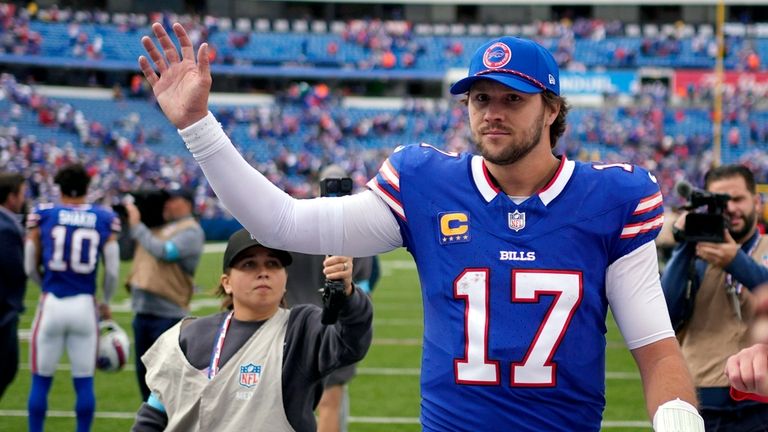 Buffalo Bills quarterback Josh Allen waves to the crowd after...