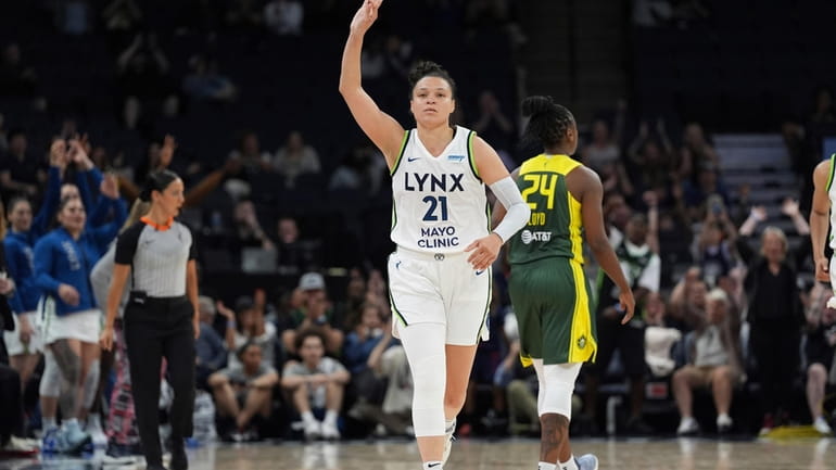 Minnesota Lynx guard Kayla McBride (21) gestures after making a...