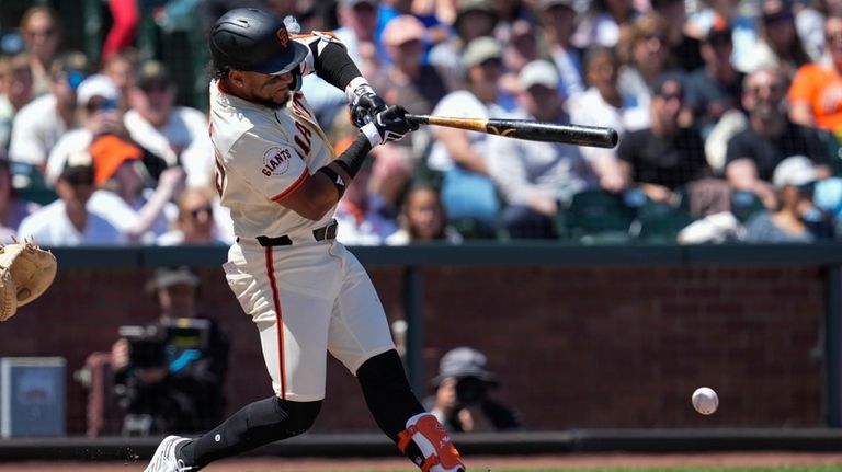 San Francisco Giants' Luis Matos hits a ground ball to...