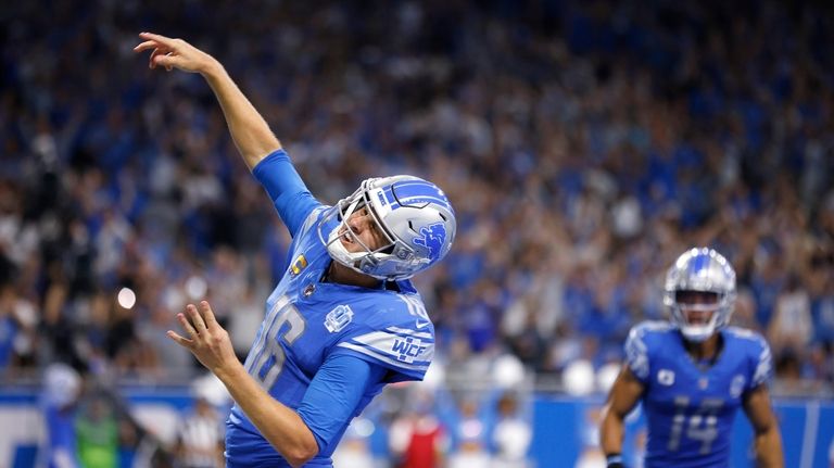 Detroit Lions quarterback Jared Goff (16) throws the ball into...