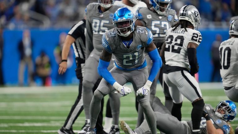 Detroit Lions safety Tracy Walker III (21) reacts after sacking...