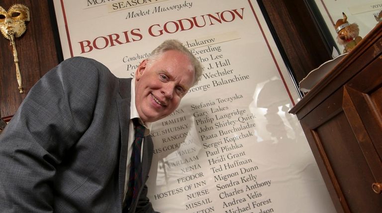 Opera singer John Horton Murray points to his name on a...