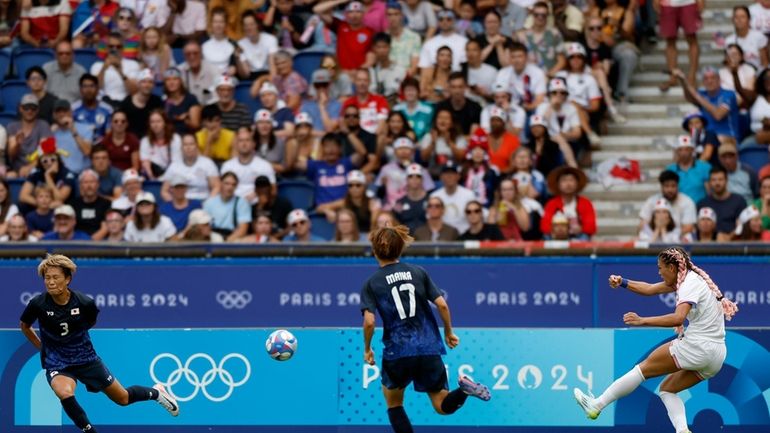 Trinity Rodman of the United States, right, scores the opening...