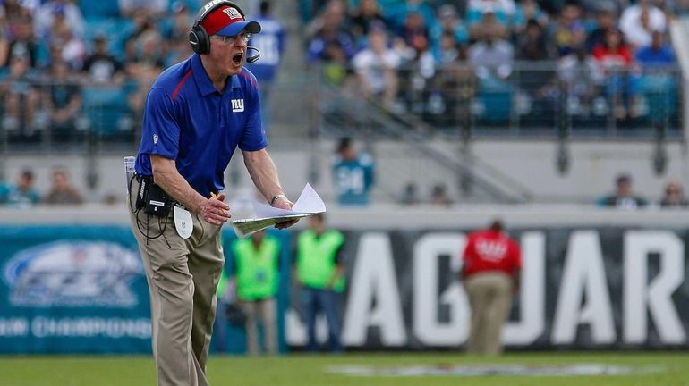 Giants head coach Tom Coughlin yells during the first half...