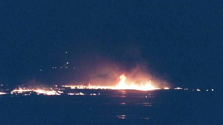 Flames from TWA Flight 800 that exploded over the water...
