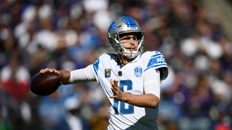 Detroit Lions quarterback Jared Goff throws during the first half...