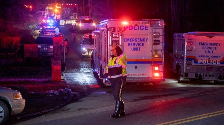 A Nassau police officer at the scene Tuesday night where...