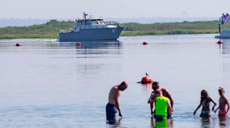 Nassau police patrol Zach's Bay after a possible shark sighting...