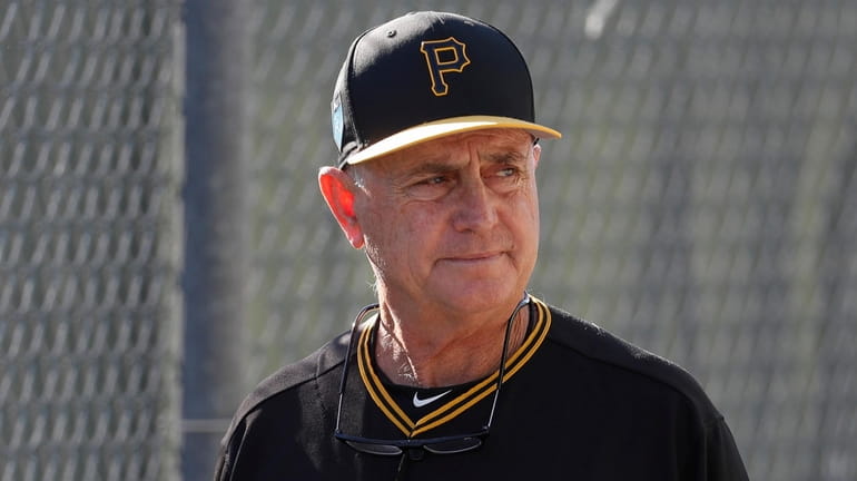 Pittsburgh Pirates coach Dave Jauss walks past the batting cages...