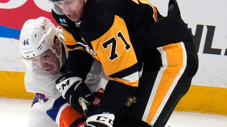 Pittsburgh Penguins' Evgeni Malkin (71) and New York Islanders' Jean-Gabriel...