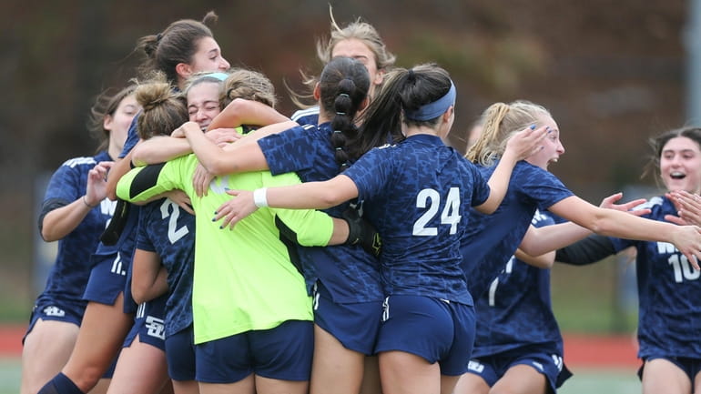 Smithtown West's players celebrate their win during the Long Island...